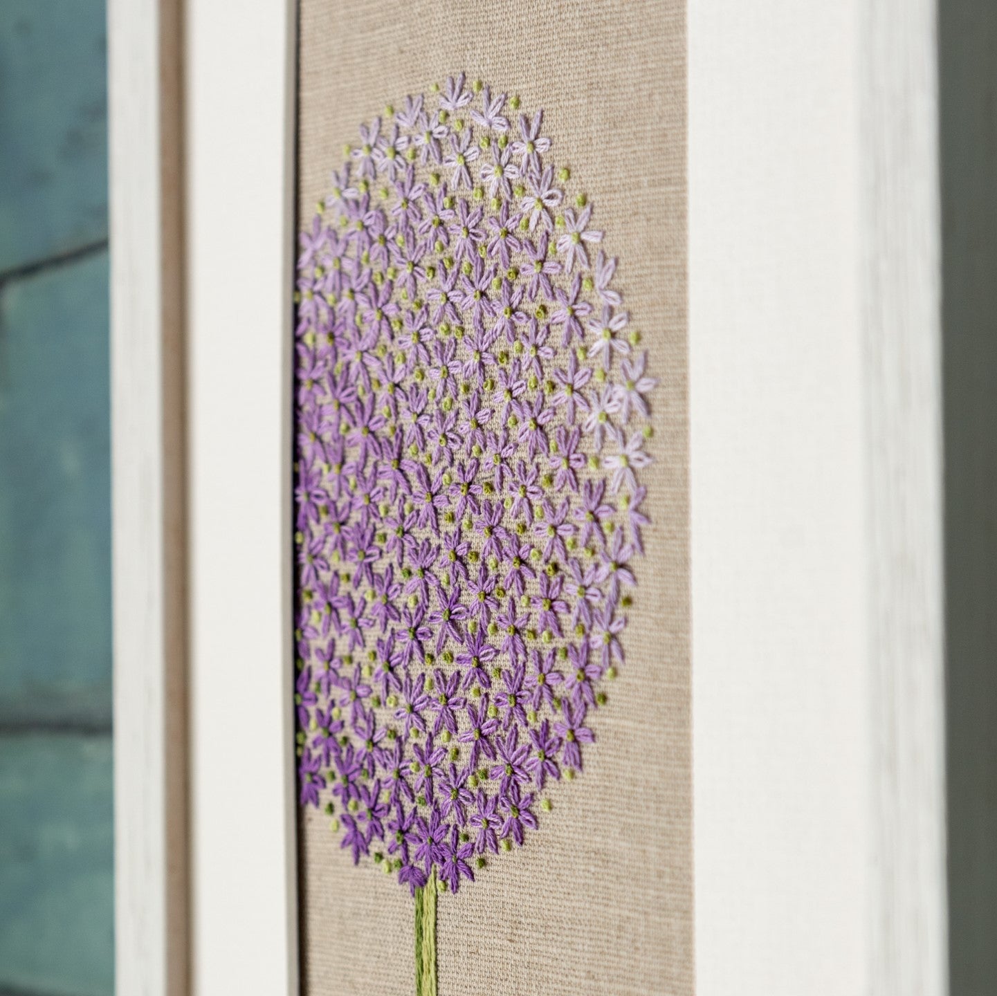 An angled close up of the finished purple allium head kit showing the detail ed stitching.