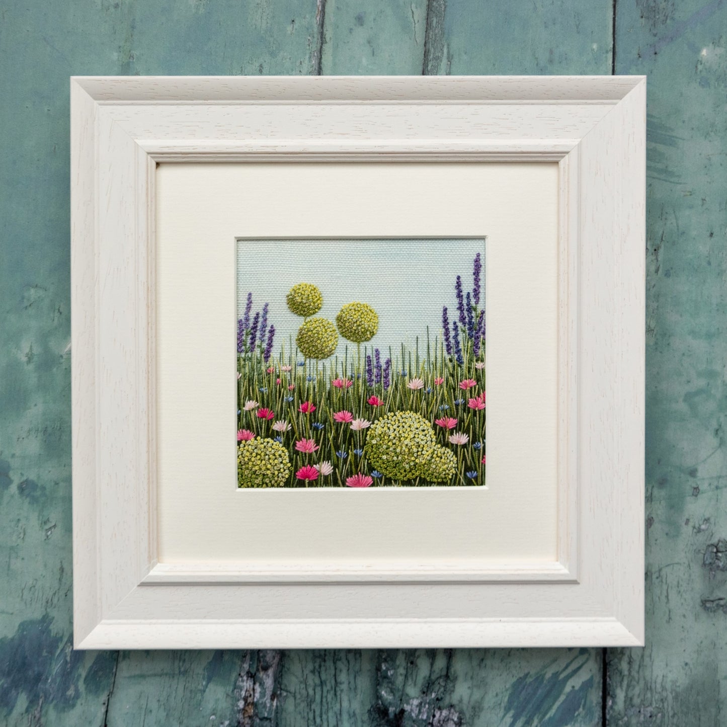 Jo Butcher's Allium meadow hand embroidery kit finished and framed with a white frame and mount