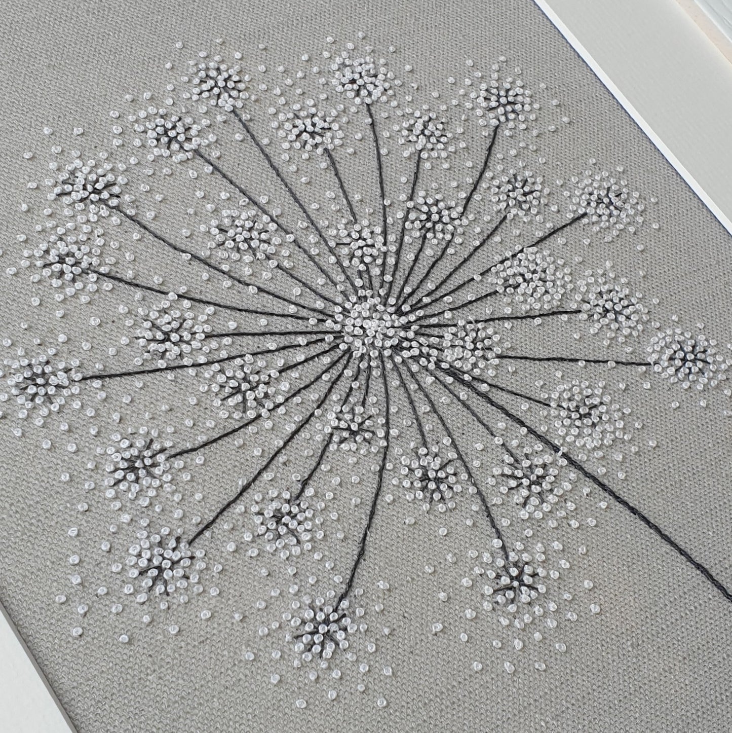 close up of the finished seedhead from above showing the detail of the French knots
