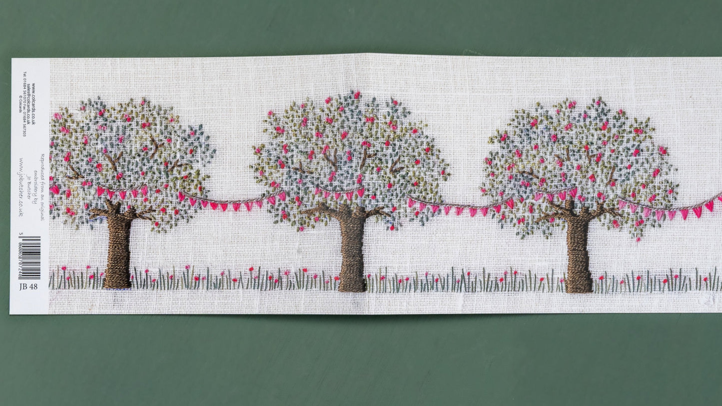 This card when open shows three hand embroidered apple trees with pink blossom. Draped between them is pretty matching pink bunting.