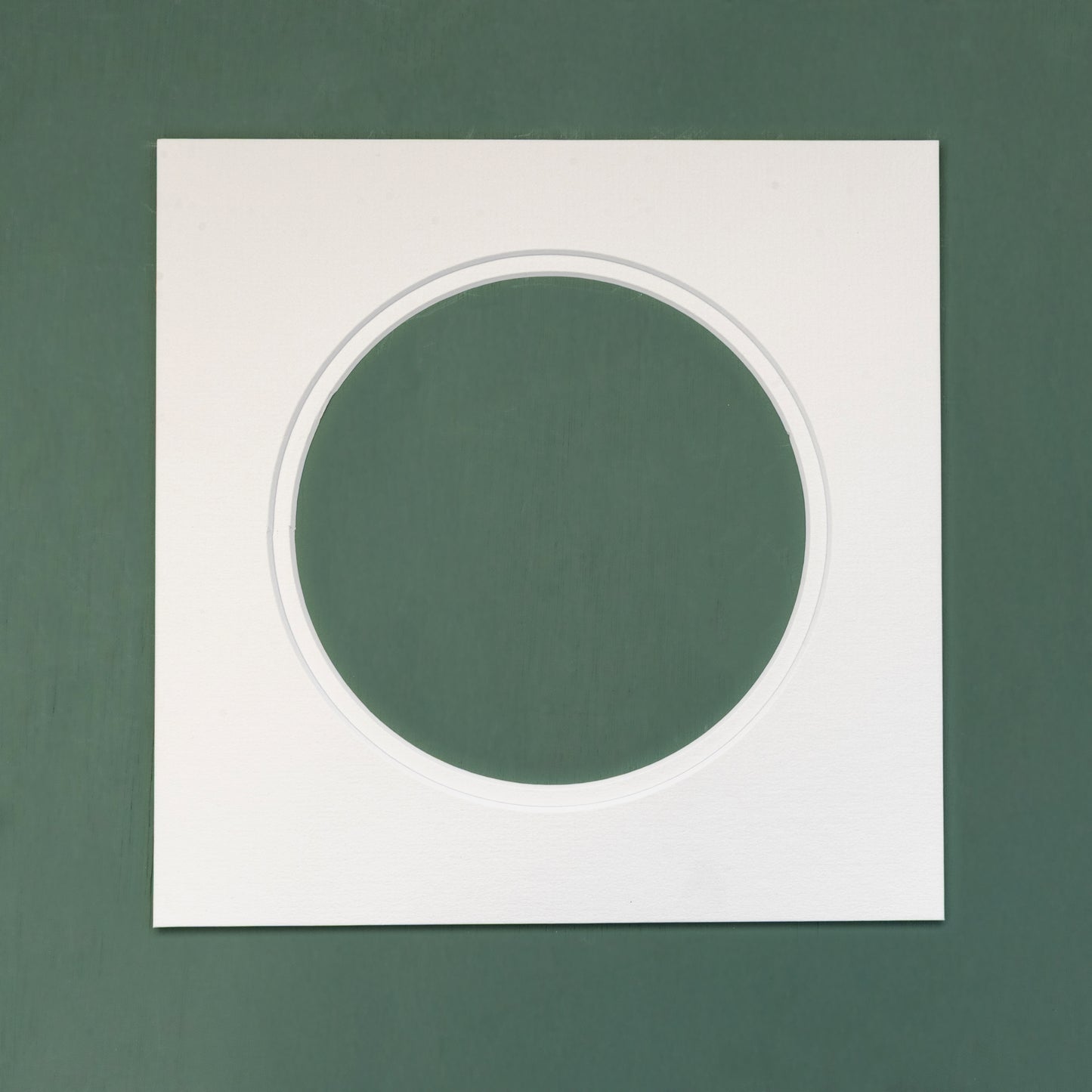 A white circular double mount to fit a 10inch square frame.