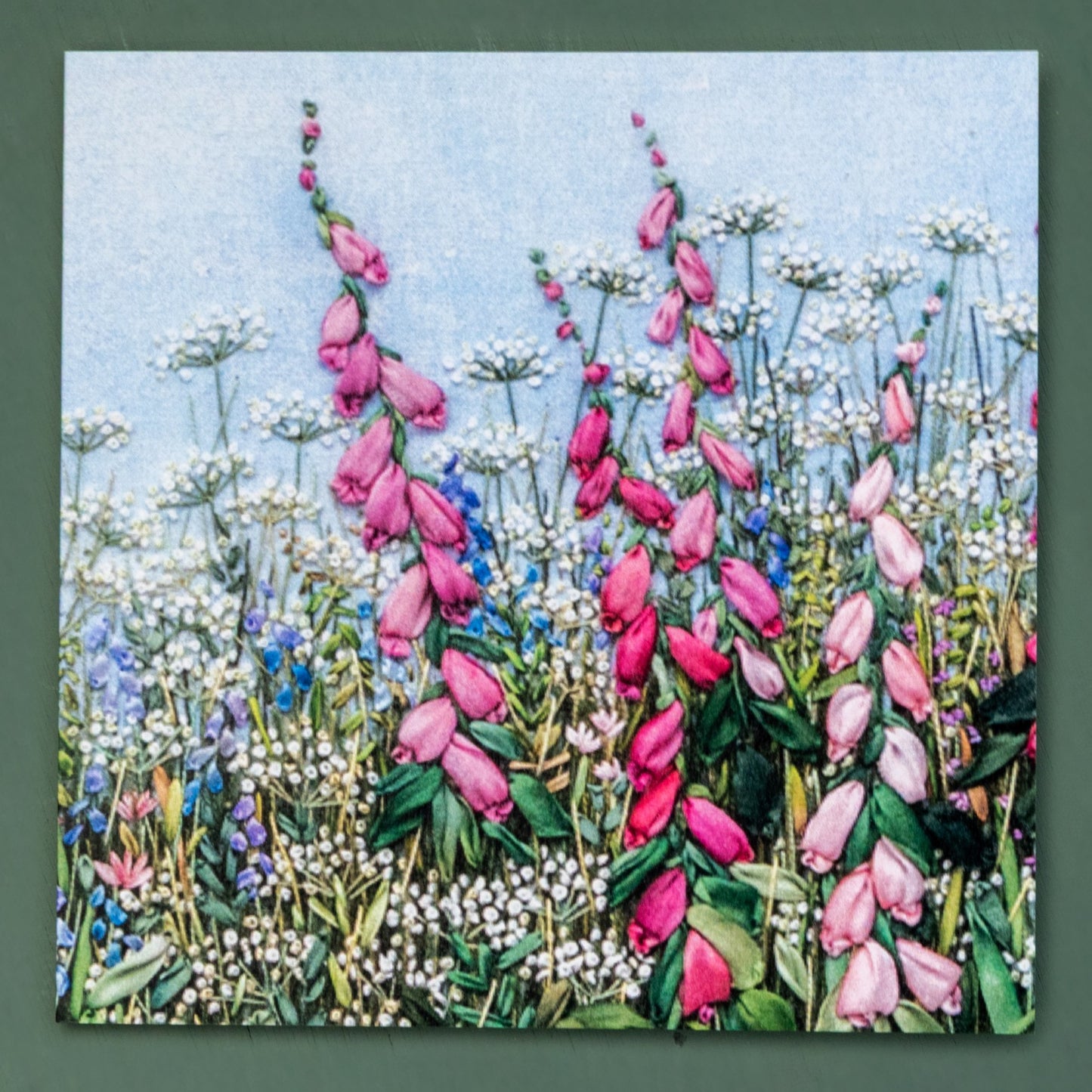 front of the card of foxgloves in a field of cow parsley.