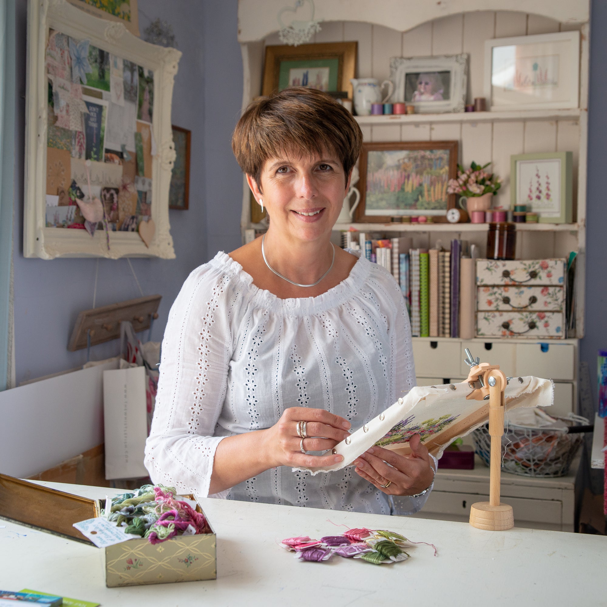 Jo Butcher at her desk sewing