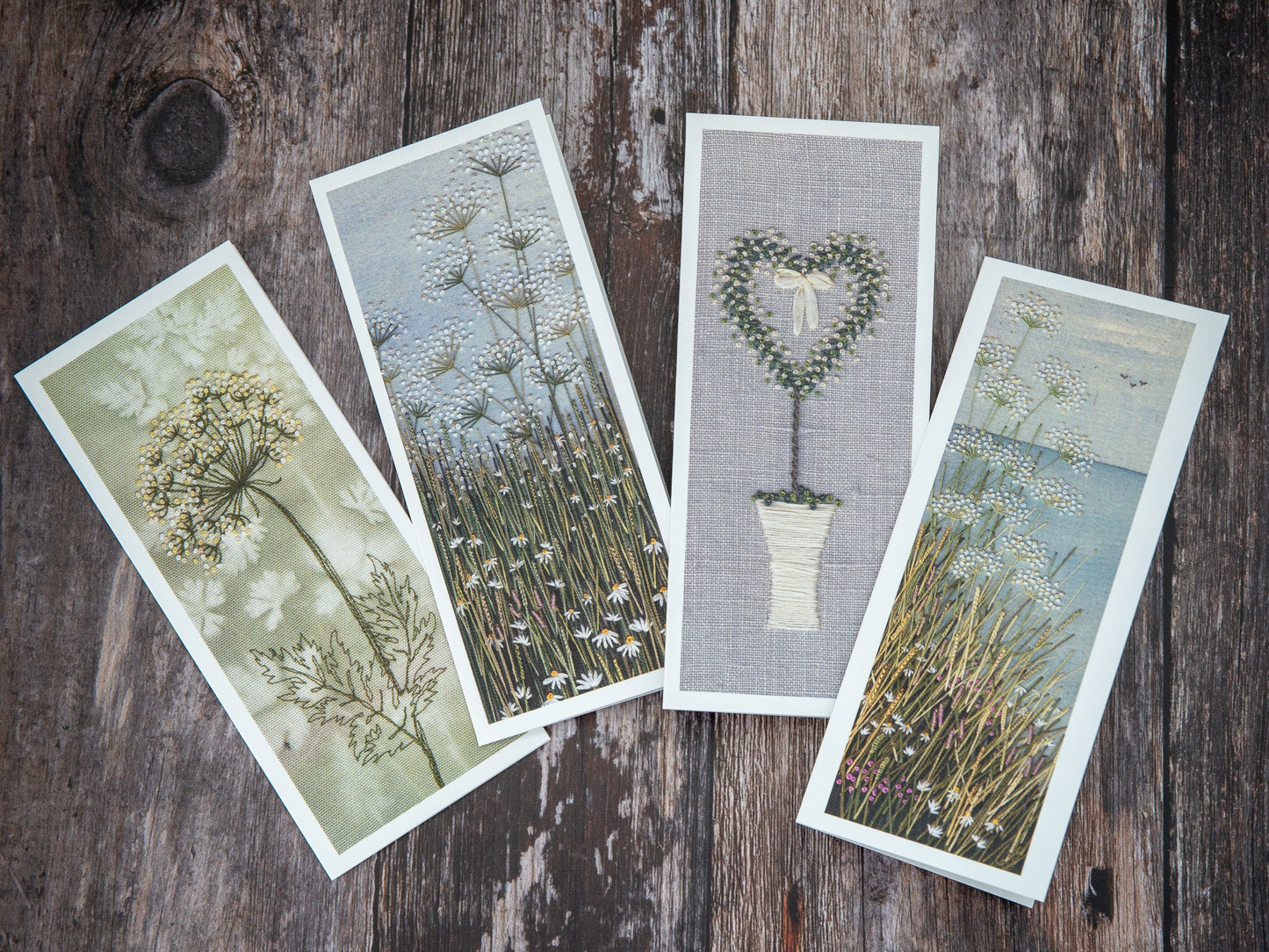 four of Jo Butcher's upright cards displayed at a fanned angle
