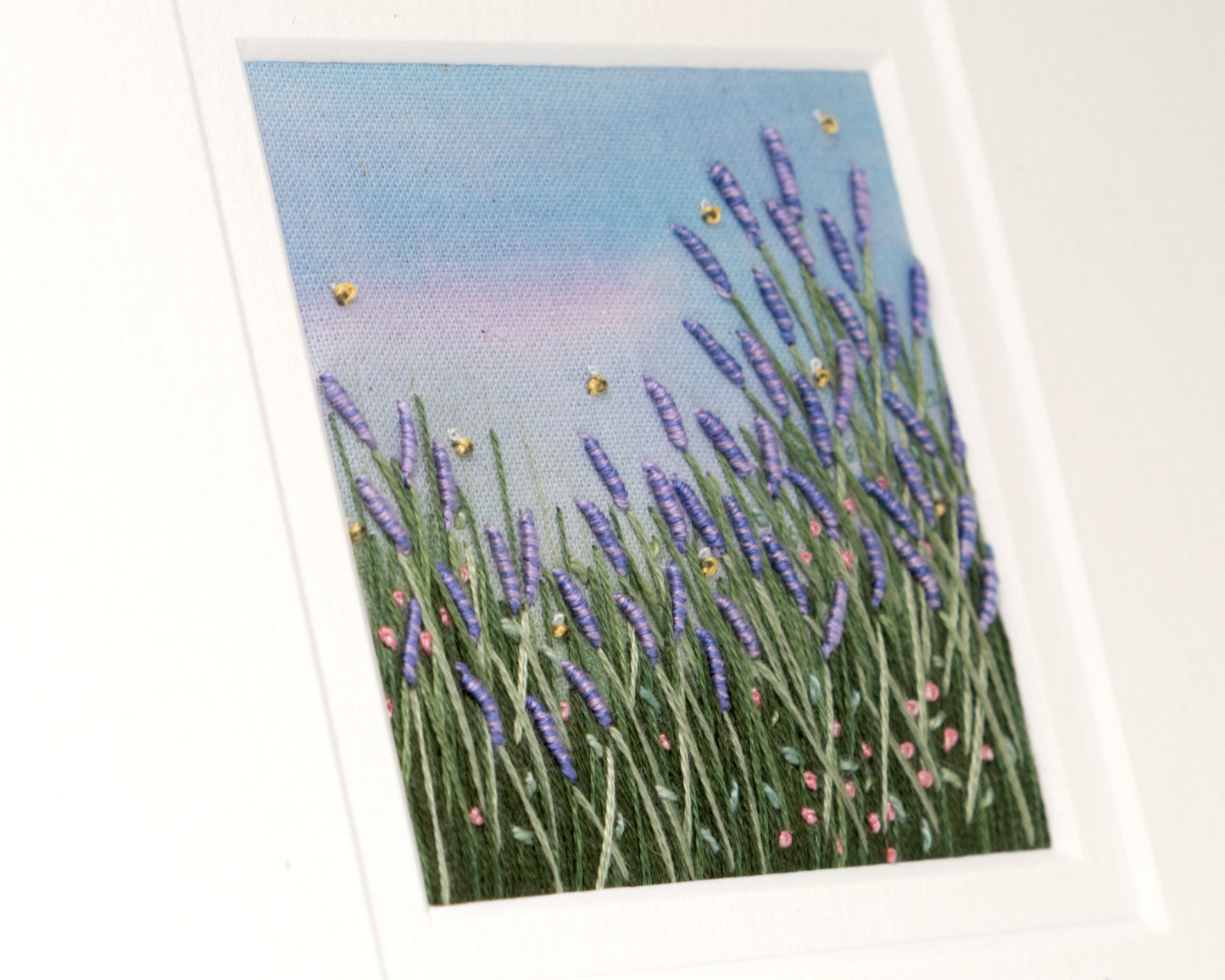 A angled close up looking across the stitched lavender meadow.