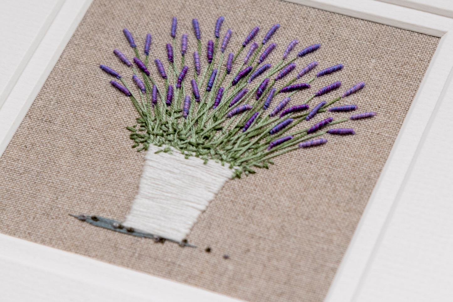 A close up view of the bullion knots used to stitch the lavender in this artwork