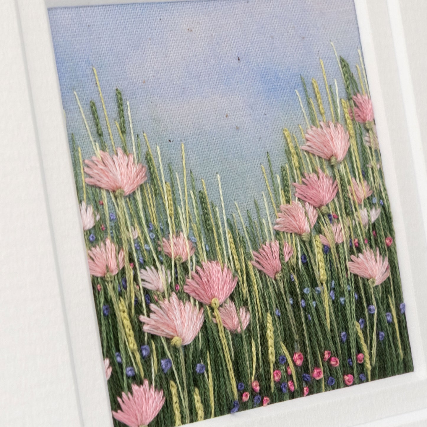 Detailed view of he stitch detail of this flower meadow.