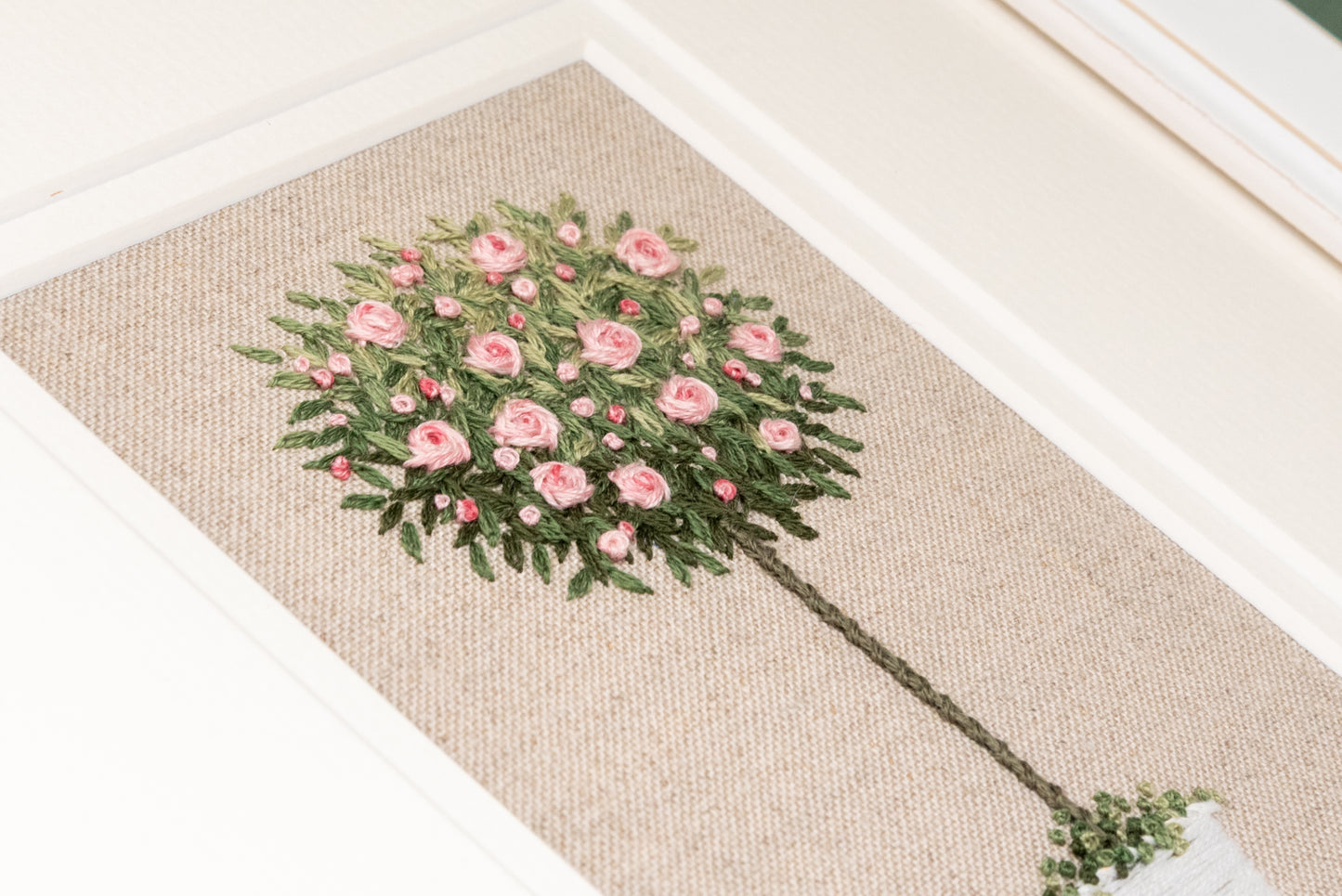 A close up of the rose tree showing the shading of the tree stitching detail.