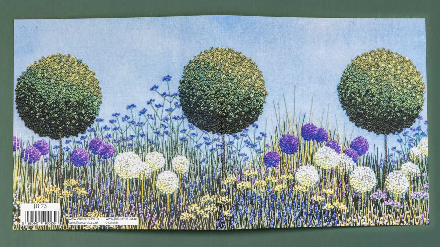 a rectangular card opened up to show the complete flower border including three topiary trees.