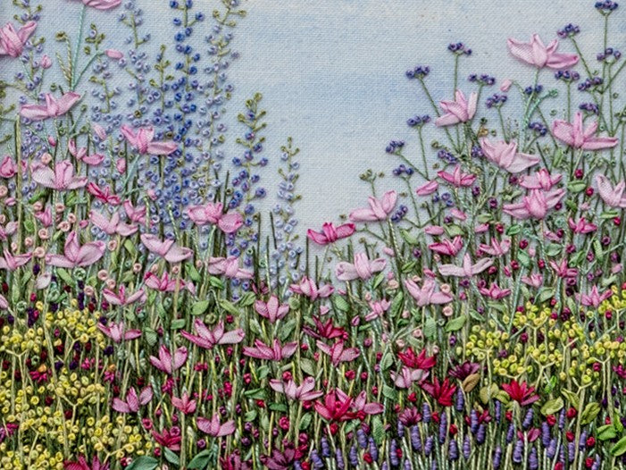 hand embroidery of a pretty flower border with mainly pink and purple flowers