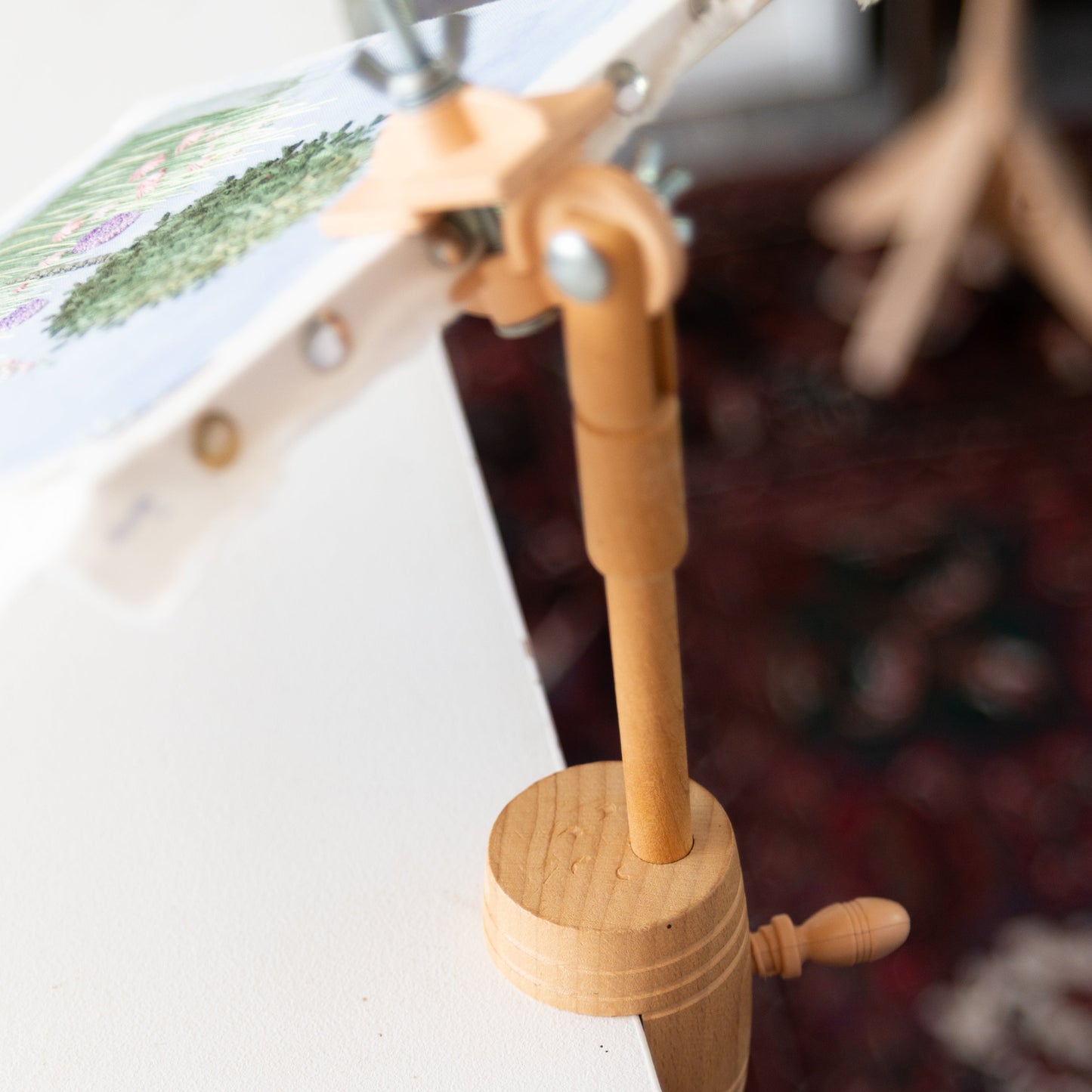 Wooden barrel that clamps to a table and holds your embroidery frame or hoop.
