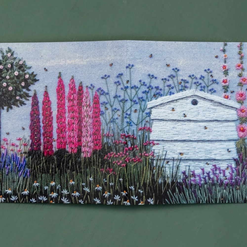 Open this card up to reveal the hive sitting ion a flower border with a range of flowers and a standard rose tree.