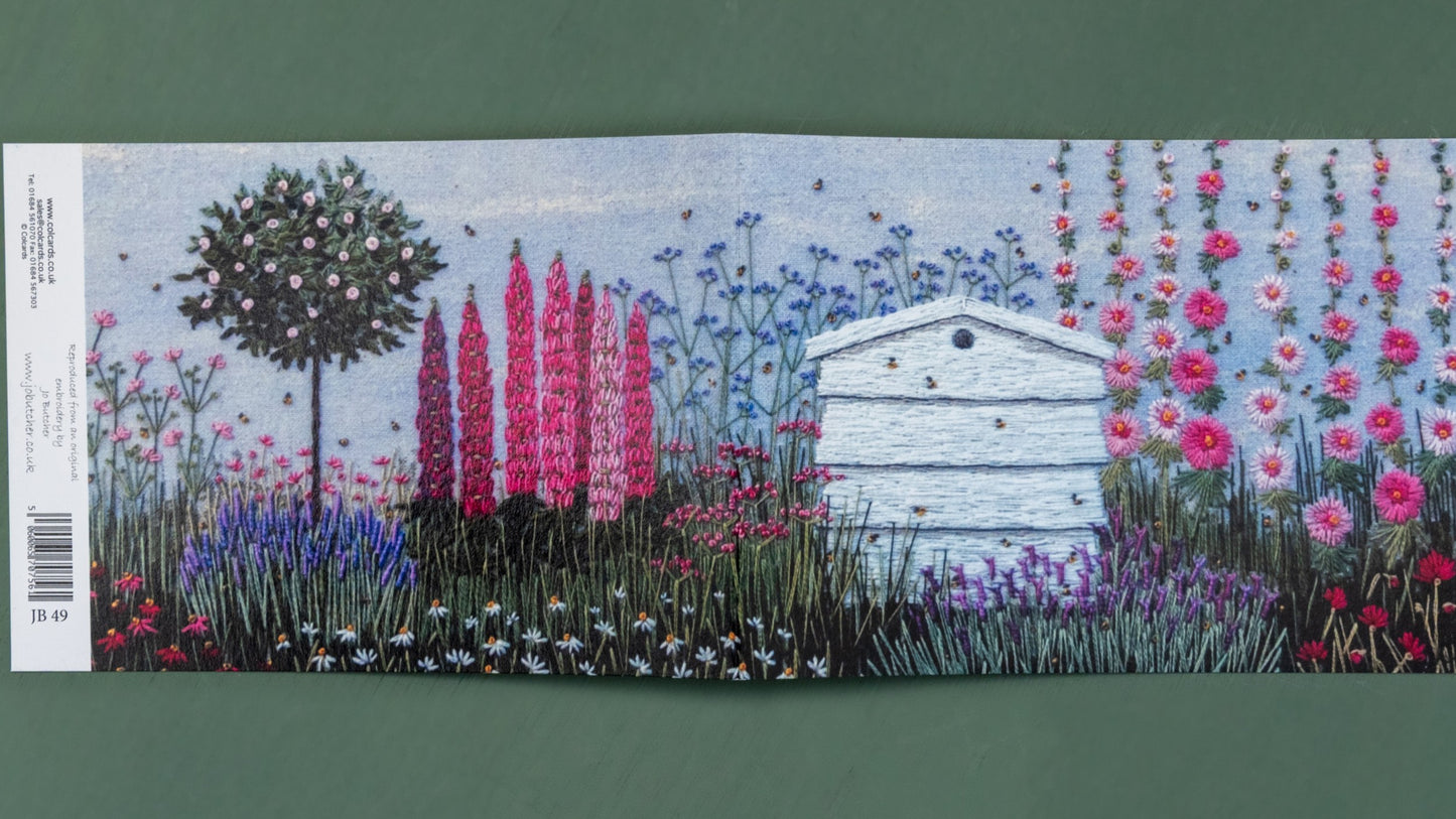 Open this card up to reveal the hive sitting ion a flower border with a range of flowers and a standard rose tree.