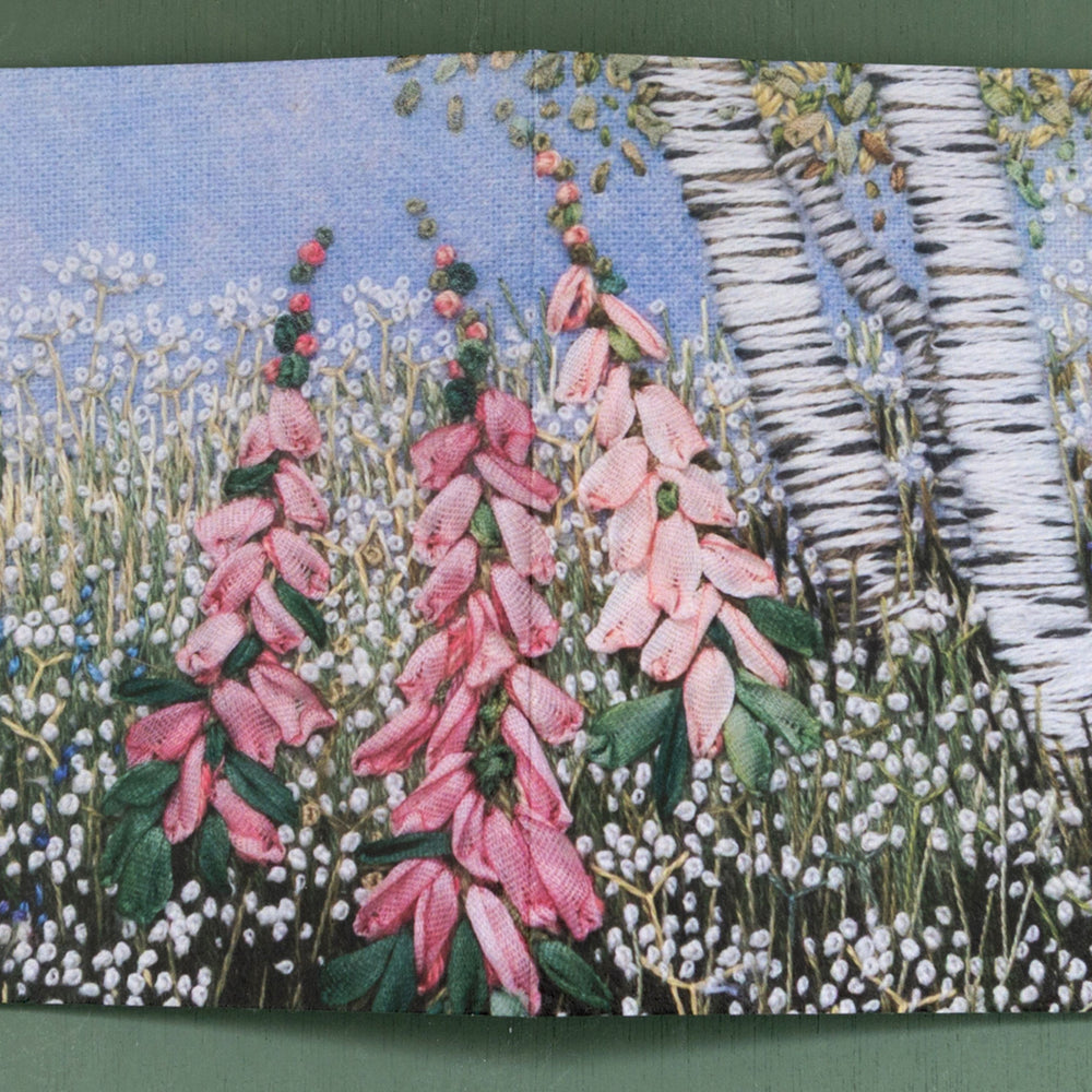 a clump of birches, foxgloves and flowers greeting card with the images wrapping around the front and back.