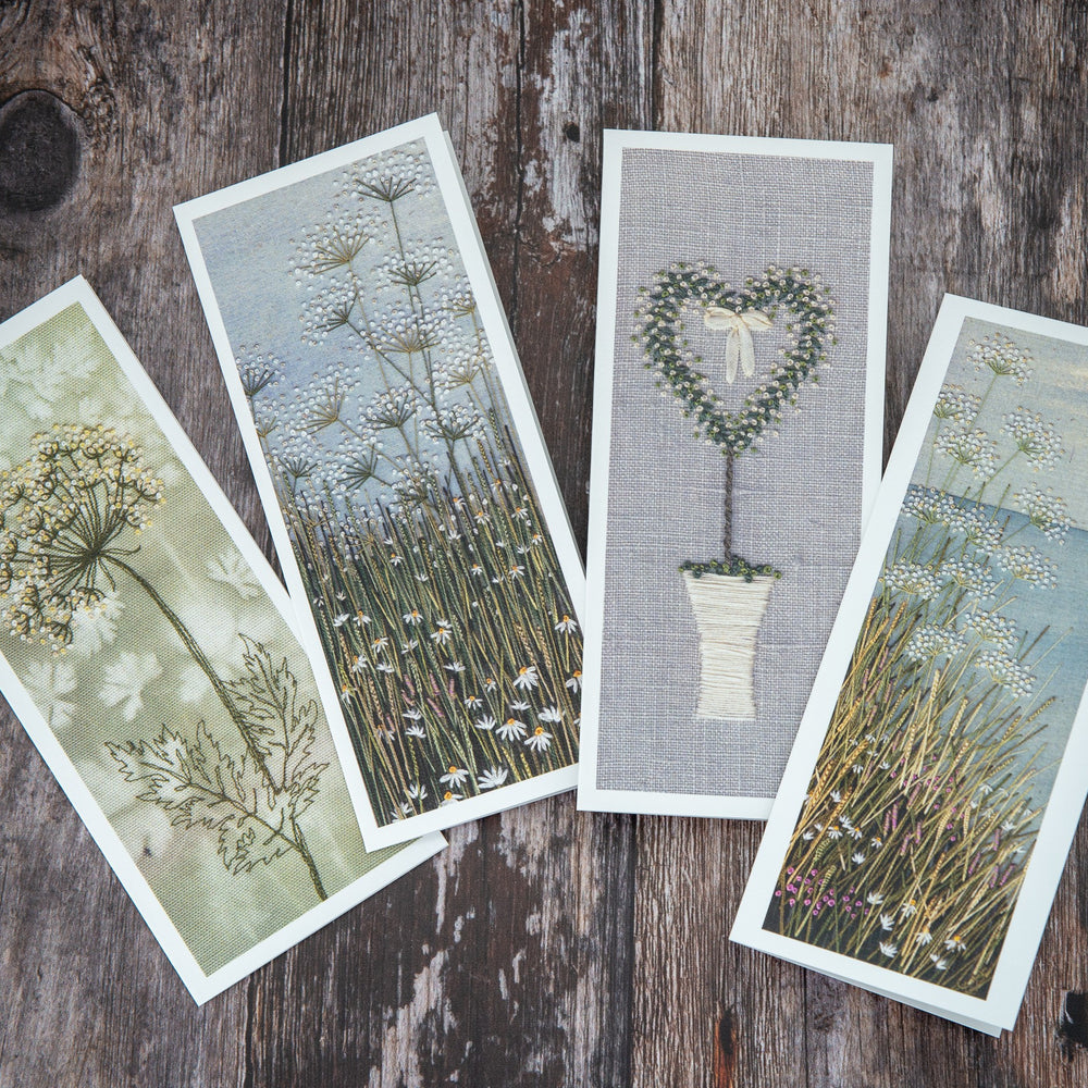 four of Jo Butcher's upright cards displayed at a fanned angle