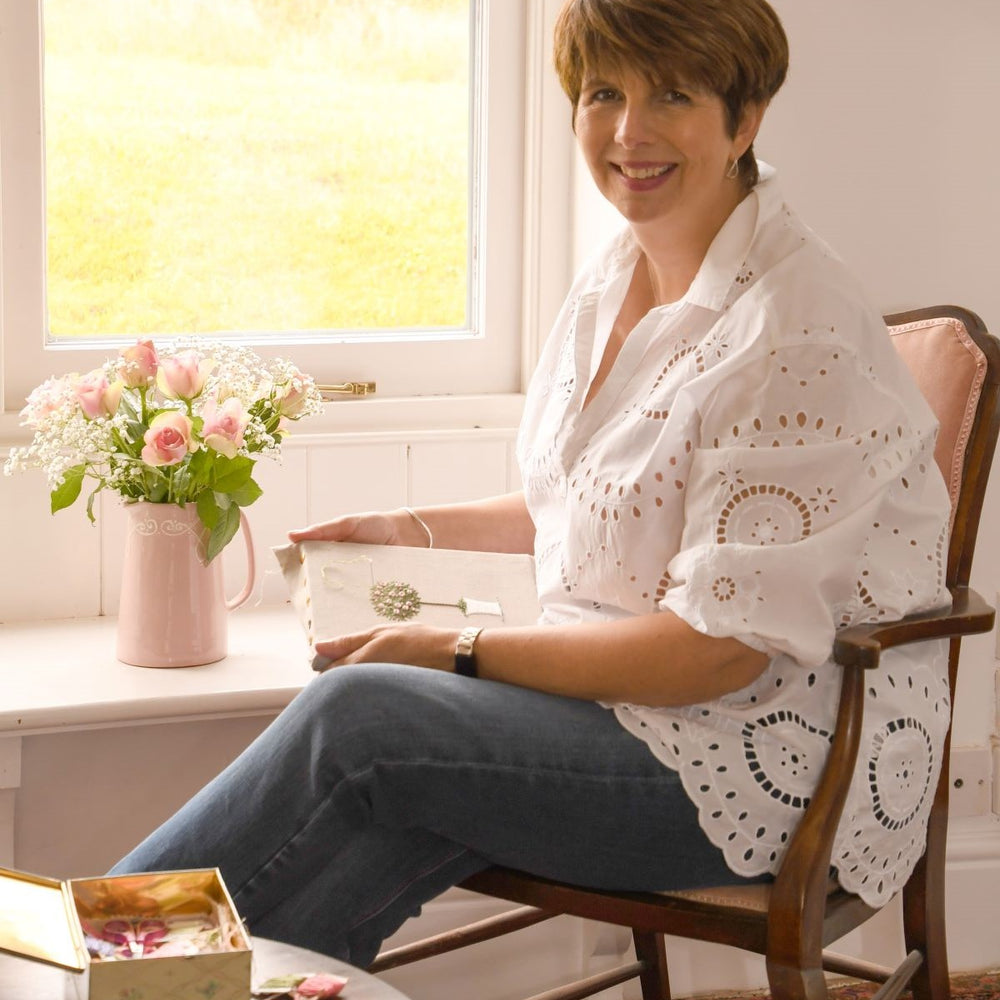 Jo Butcher sitting at a window in her studio 
