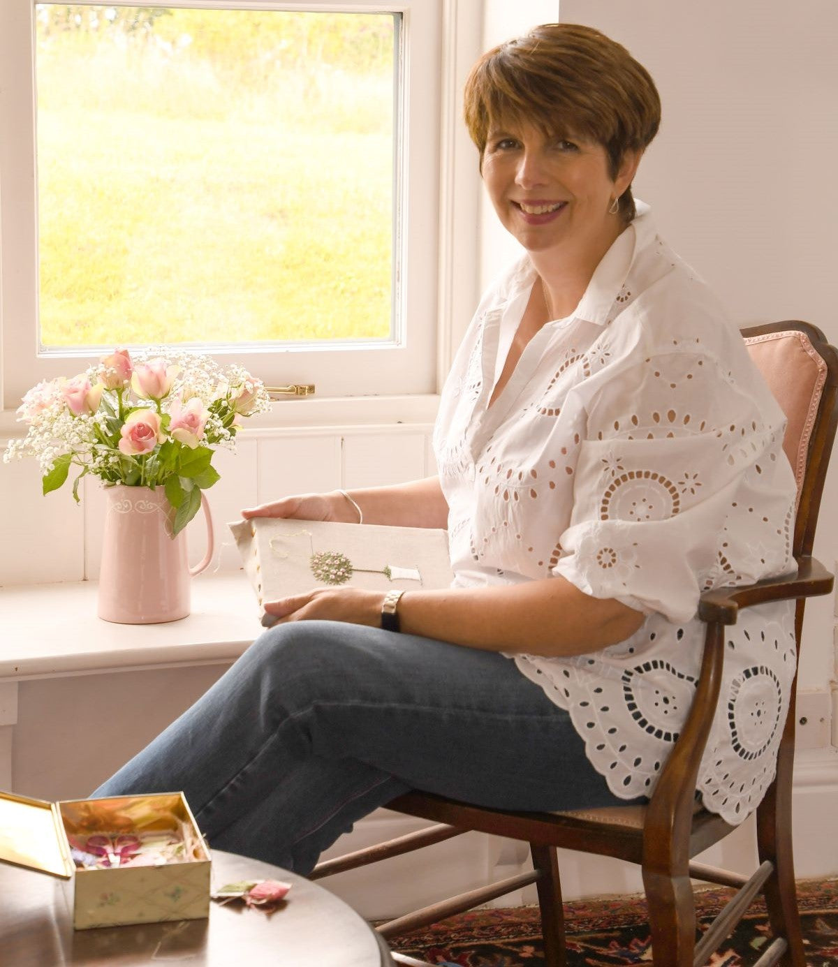 Jo Butcher sitting at a window in her studio 