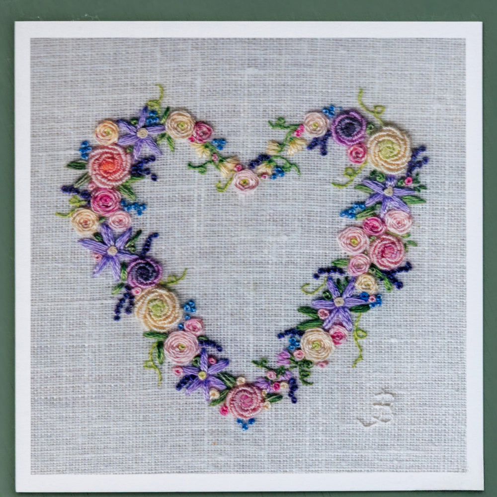 A colourful hand embroidered flower heart. 