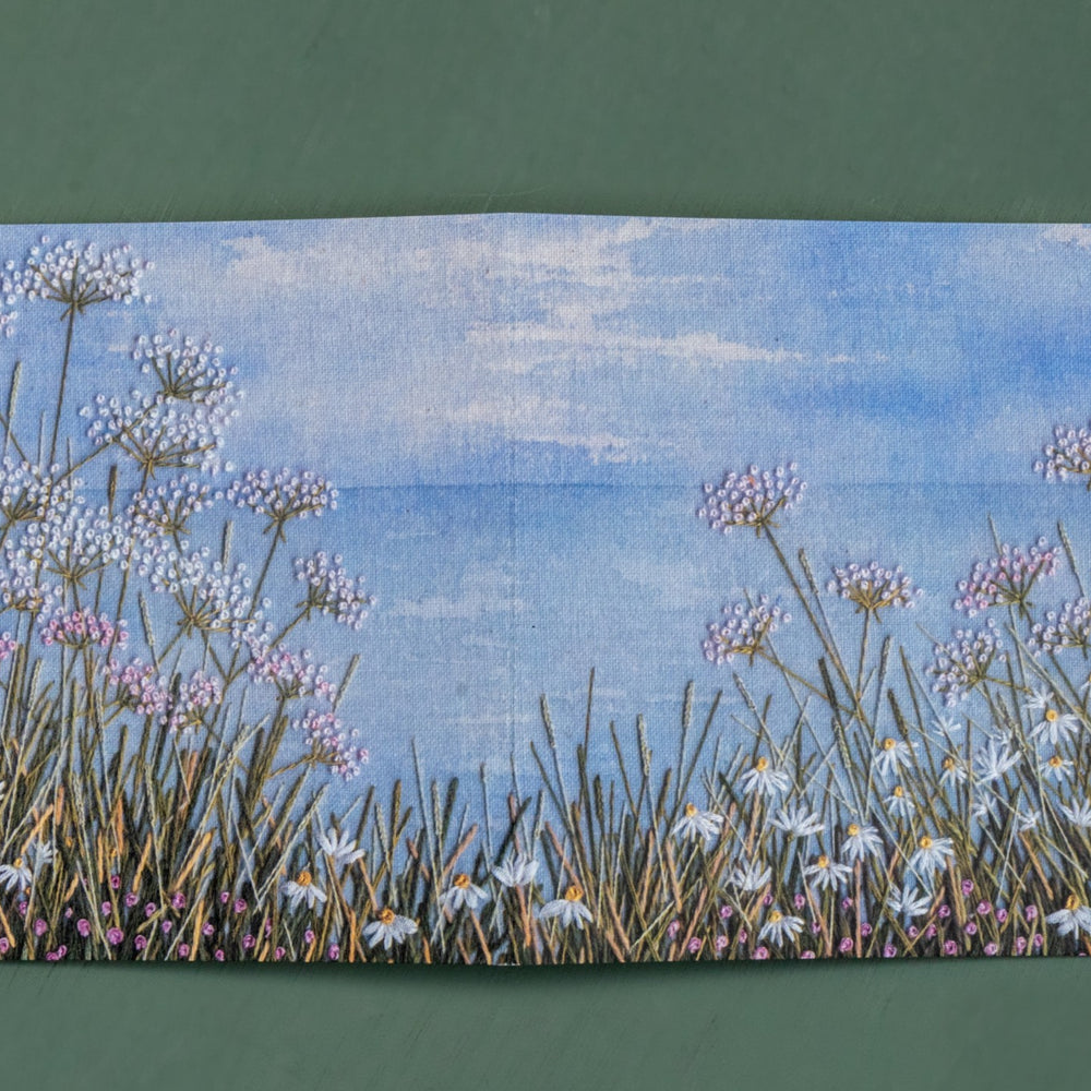 open this card out for a wider view of a meadow cliff top with the horizon in the distance.