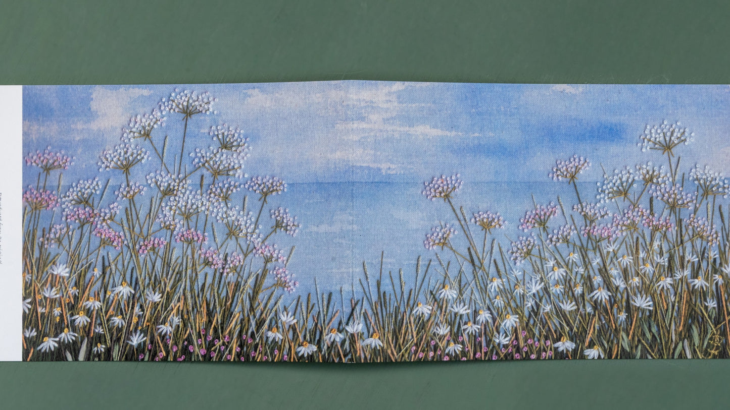 open this card out for a wider view of a meadow cliff top with the horizon in the distance.