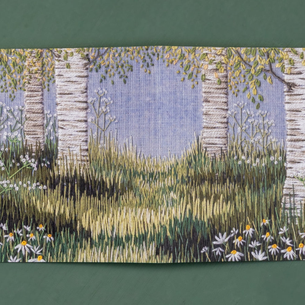 Opened up this card reveals a wider scene  of birches, grasses and daises.
