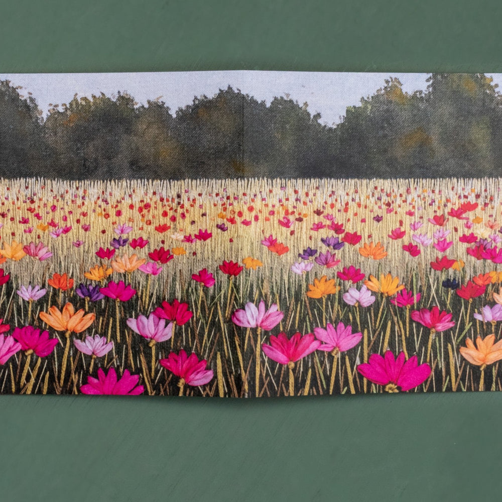 Bright poppies fill this summer meadow all the way to the distant hedges