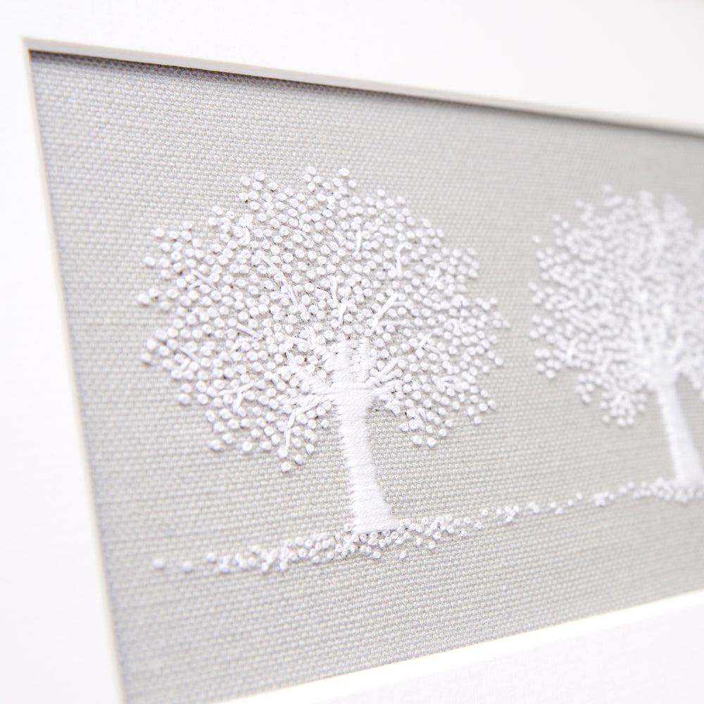 detailed view of one of the three white trees