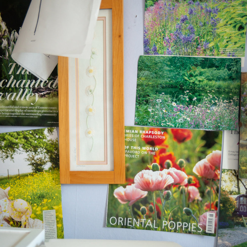 frames artwork and magazine pictures staged on pinboard