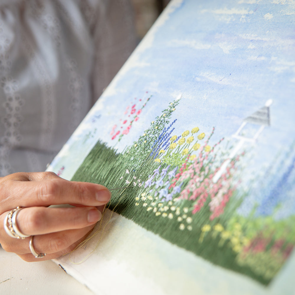 close up of jo's hand embroidering